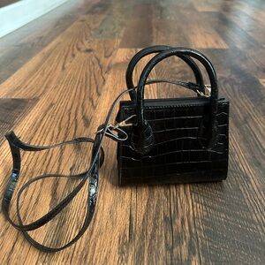 Small, cross body black purse